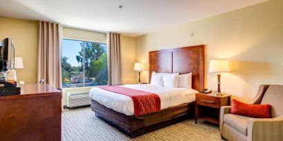 Dayroom with TV and natural light at Comfort Inn Pomona Near Fairplex.