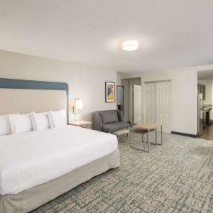 Spacious day use room with sofa and work desk at Homewood Suites By Hilton Miami Airport-Blue Lagoon.