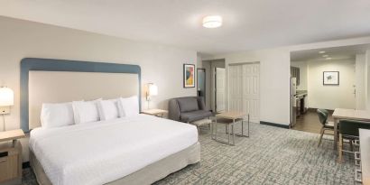 Spacious day use room with sofa and work desk at Homewood Suites By Hilton Miami Airport-Blue Lagoon.