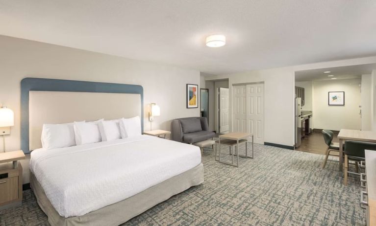 Spacious day use room with sofa and work desk at Homewood Suites By Hilton Miami Airport-Blue Lagoon.