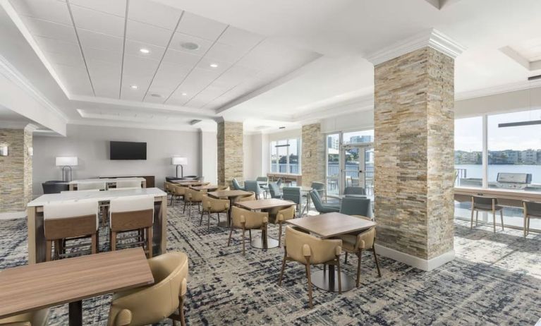 Dining area and coworking space at Homewood Suites By Hilton Miami Airport-Blue Lagoon.