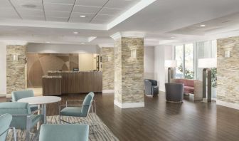 Lobby and coworking lounge at Homewood Suites By Hilton Miami Airport-Blue Lagoon.