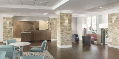 Lobby and coworking lounge at Homewood Suites By Hilton Miami Airport-Blue Lagoon.