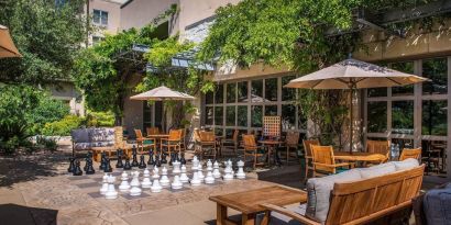 Outdoor garden and coworking space at Hilton San Antonio Hill Country.