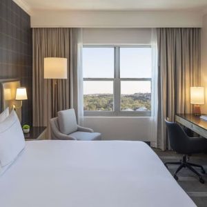 Day use room with work desk and natural light at Hilton San Antonio Hill Country.
