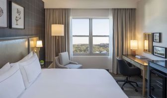 Day use room with work desk and natural light at Hilton San Antonio Hill Country.