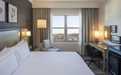 Day use room with work desk and natural light at Hilton San Antonio Hill Country.