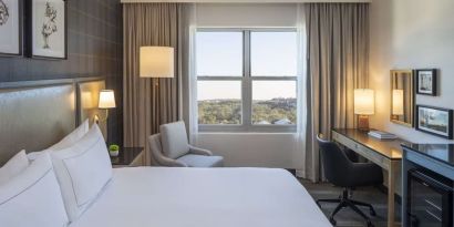 Day use room with work desk and natural light at Hilton San Antonio Hill Country.