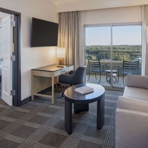 Day use room with living area and balcony at Hilton San Antonio Hill Country.