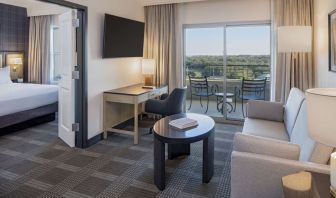 Day use room with living area and balcony at Hilton San Antonio Hill Country.