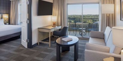 Day use room with living area and balcony at Hilton San Antonio Hill Country.