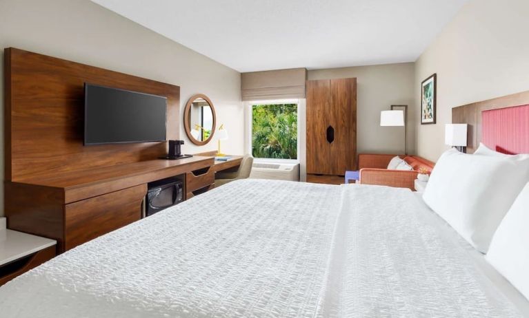 Day use room with work desk and natural light at Hampton Inn Ft. Lauderdale-Cypress Creek.