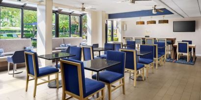 Dining and coworking space at Hampton Inn Ft. Lauderdale-Cypress Creek.