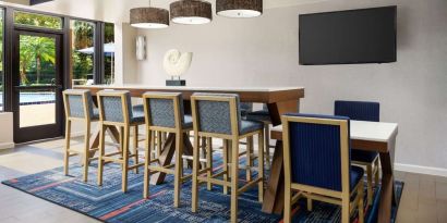 Lobby and coworking lounge at Hampton Inn Ft. Lauderdale-Cypress Creek.