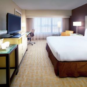 Day use room with work desk and natural light at Hilton Los Angeles Airport.
