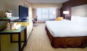Day use room with work desk and natural light at Hilton Los Angeles Airport.
