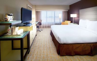 Day use room with work desk and natural light at Hilton Los Angeles Airport.
