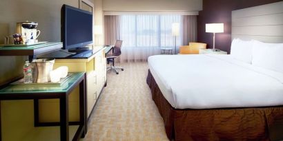 Day use room with work desk and natural light at Hilton Los Angeles Airport.
