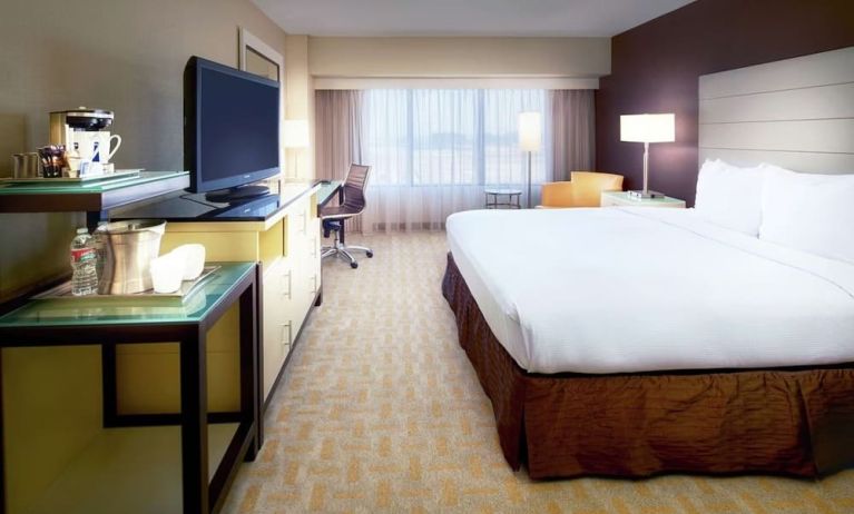 Day use room with work desk and natural light at Hilton Los Angeles Airport.
