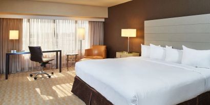 Spacious day use room with work desk and natural light at Hilton Los Angeles Airport.