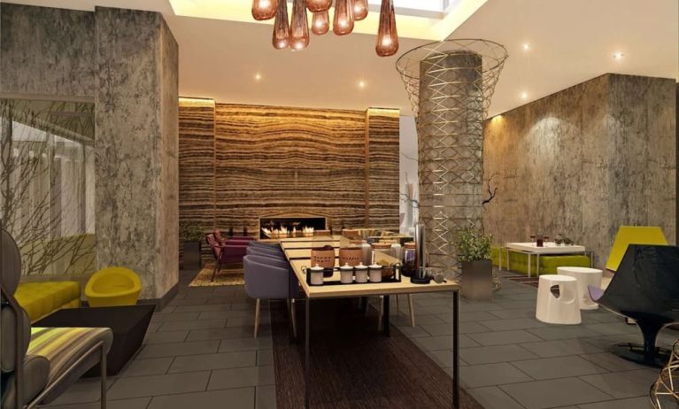 Lobby lounge and workspace with coffee service and fireplace at Hilton Garden Inn New York/Manhattan-Midtown East.