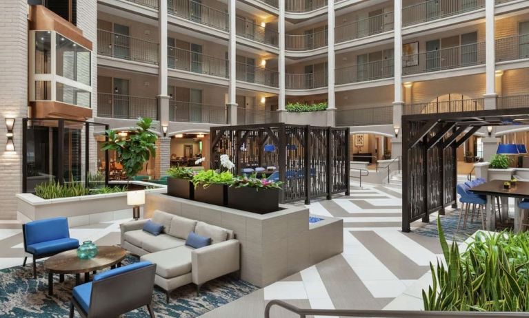 Lobby lounge and workspace at Embassy Suites By Hilton Arcadia Pasadena Area.