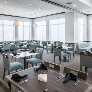 Dining area with comfortable seating, perfect for coworking at Hilton Garden Inn Dothan.