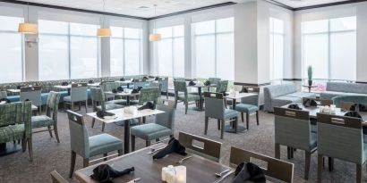 Dining area with comfortable seating, perfect for coworking at Hilton Garden Inn Dothan.