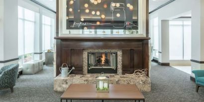 Lobby lounge area with fireplace at Hilton Garden Inn Dothan.