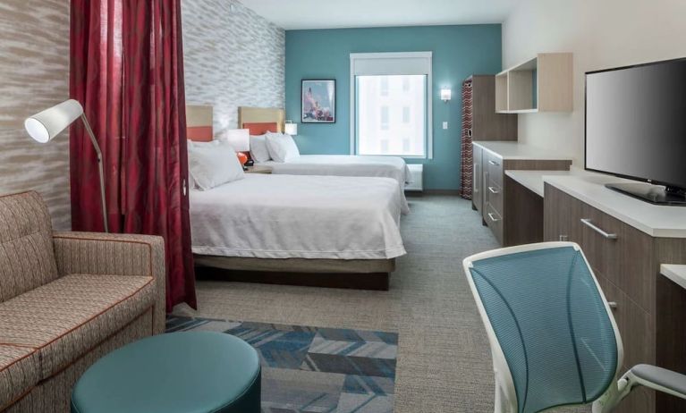 Day use twin room with work desk and lounge area at Home2 Suites By Hilton Cape Canaveral Cruise Port.