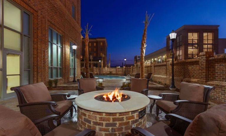 Outdoor seating and fire pit at Embassy Suites By Hilton Savannah.