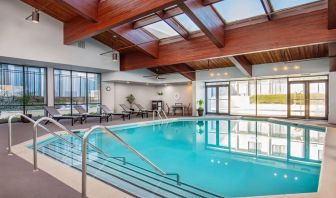 Relaxing indoor pool with lounge chairs at DoubleTree By Hilton Washington DC North/Gaithersburg.