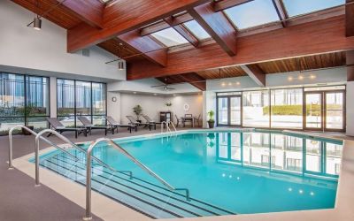 Relaxing indoor pool with lounge chairs at DoubleTree By Hilton Washington DC North/Gaithersburg.