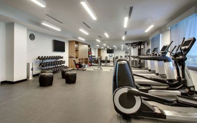 Well equipped fitness center at The Rose Hotel Chicago O’Hare, Tapestry Collection By Hilton.