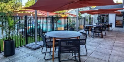 Hotel terrace with lounge seating at Hampton Inn Vallejo.