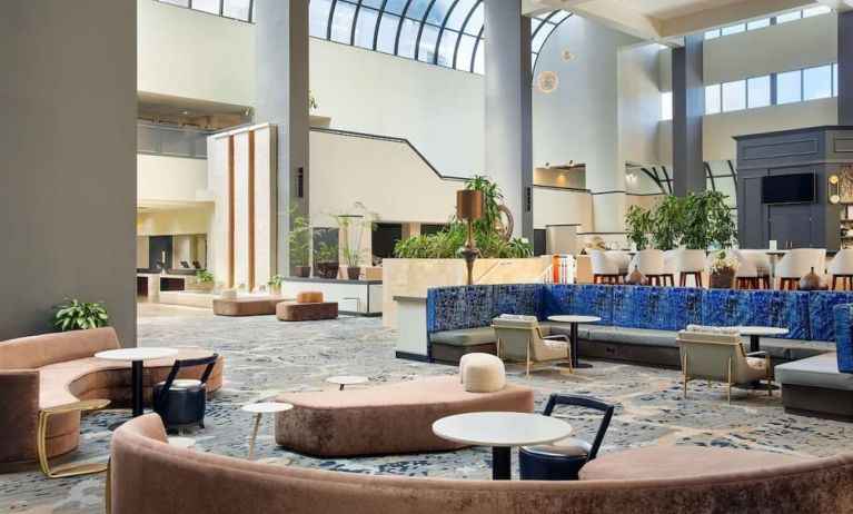 Lobby lounge area at Embassy Suites By Hilton West Palm Beach Central.