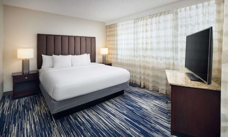 King bed at Embassy Suites By Hilton West Palm Beach Central.