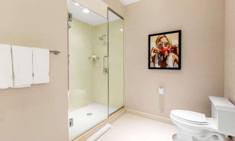 Private guest bathroom with shower and free toiletries at The Chicago Hotel Collection - Magnificent Mile.