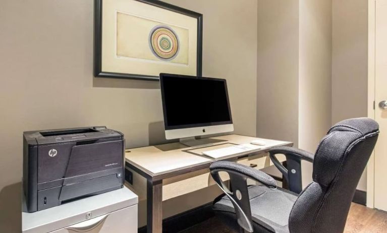 Business center with computer, printer and ergonomic chair at The Chicago Hotel Collection - Magnificent Mile.