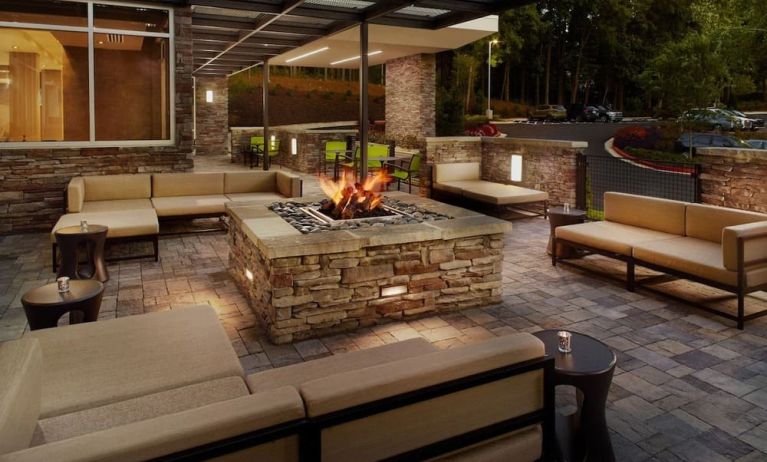Patio with lounge seating and fire pit at 	SpringHill Suites Atlanta Northwest.