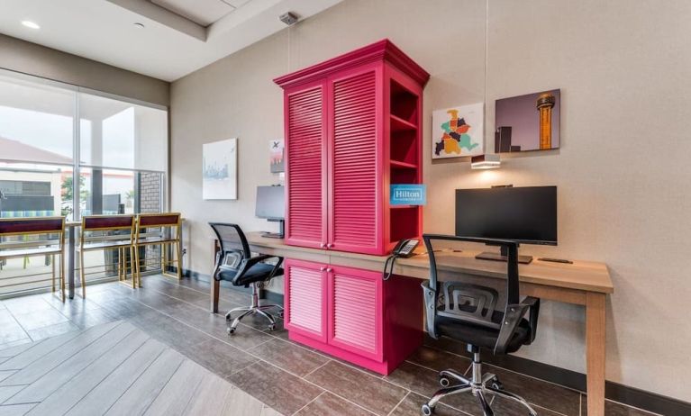 Business center with computers, printer and ergonomic chair at Home2 Suites By Hilton Dallas Medical District Lovefield.