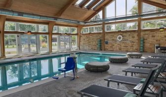 Pool loungers and indoor pool at Crowne Plaza Chicago SW.