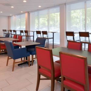 Dining area with comfortable seating at Holiday Inn Express Towson Baltimore North.