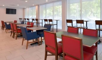 Dining area with comfortable seating at Holiday Inn Express Towson Baltimore North.