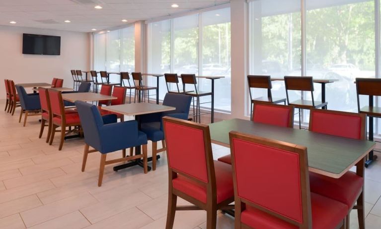 Dining area with comfortable seating at Holiday Inn Express Towson Baltimore North.