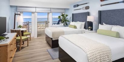 Day use twin room with workspace and balcony at Sea Crest Beach Hotel.