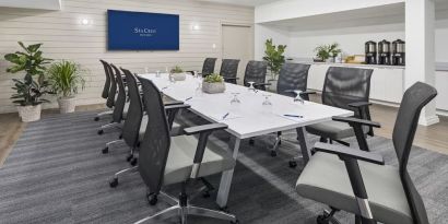 Professional meeting room with ergonomic chairs at Sea Crest Beach Hotel.