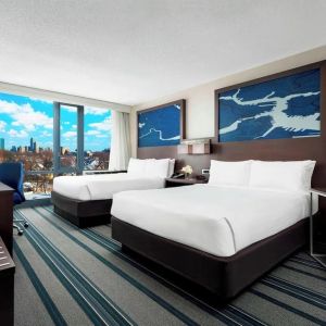 Day use twin room with work desk and living area at Courtyard Boston Cambridge.