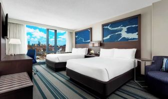 Day use twin room with work desk and living area at Courtyard Boston Cambridge.