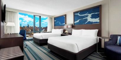 Day use twin room with work desk and living area at Courtyard Boston Cambridge.
